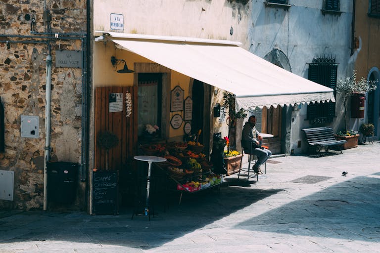Outdoor market in Rome, Italy with fresh produce and a sunny ambiance. Perfect for travel and culture themes.